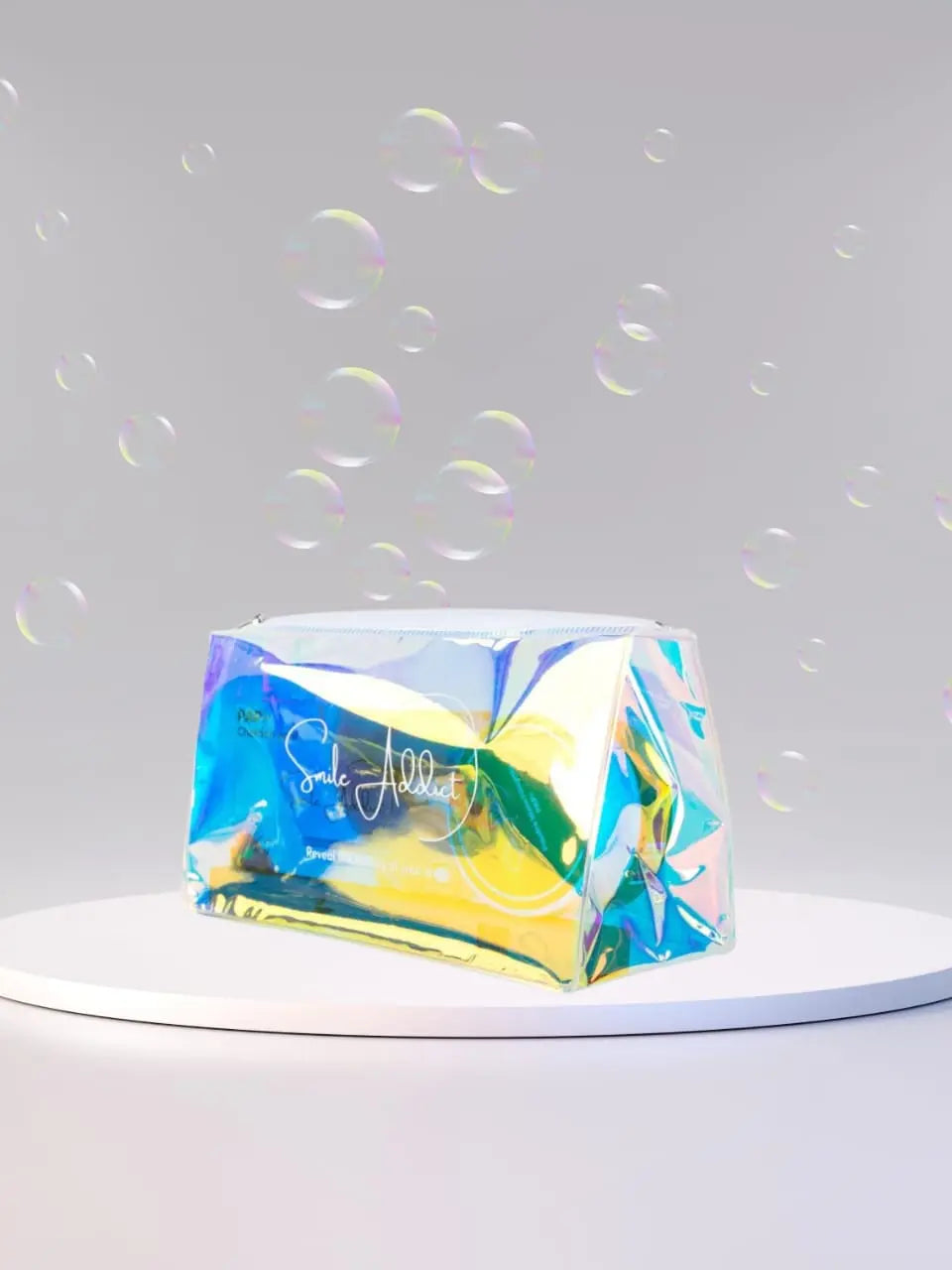 The Trousse de Toilette Smile Addict – Élégante, Pratique et Durable is showcased on a white circular platform, surrounded by floating transparent bubbles against a soft gray background.