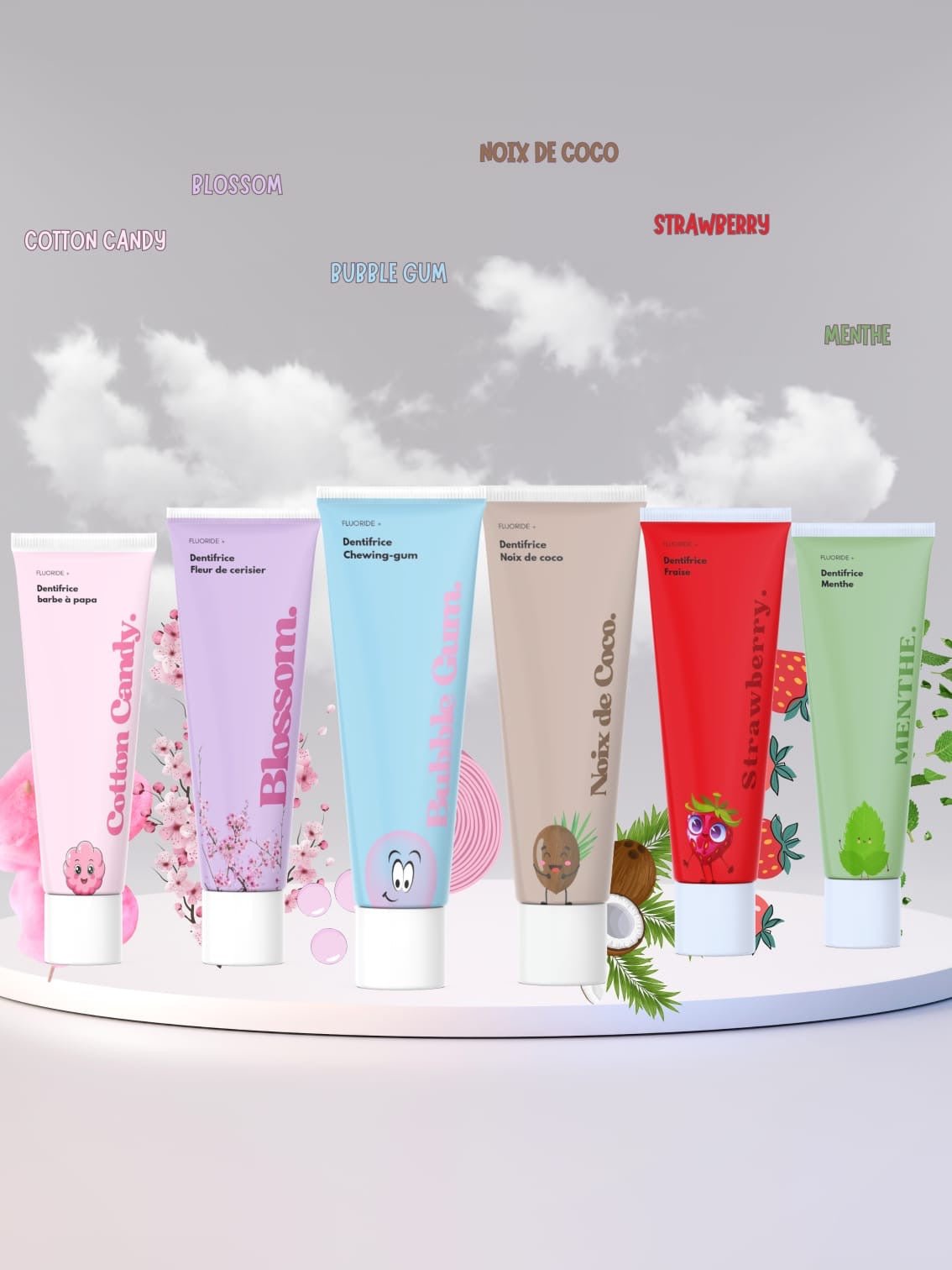 The Pack Dentifrice Adulte Saveurs Originales - Lot 6 Tubes Variés offers six upright pastel tubes with matching illustrations and flavor names—cotton candy, blossom, bubble gum, coconut, strawberry, and mint—for a fun oral care routine.